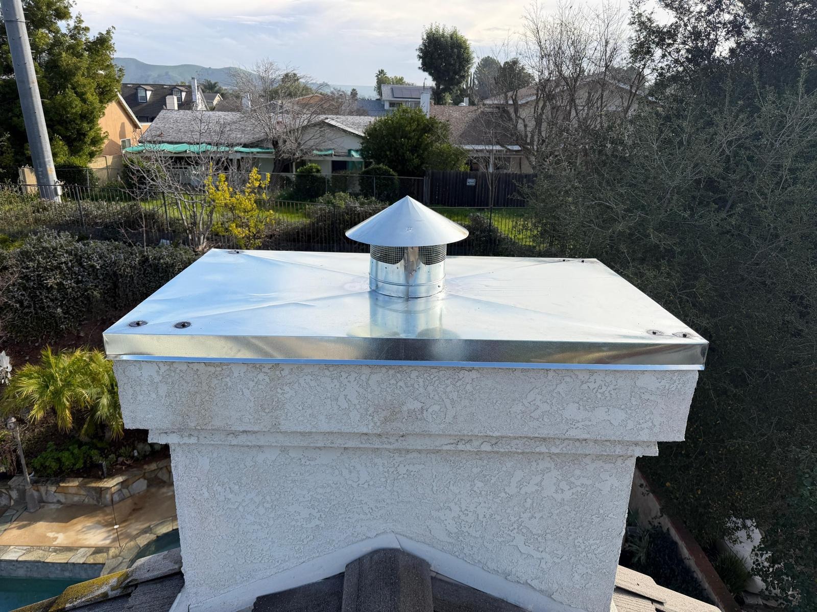 CHIMNEY CAP INSTALLATION.